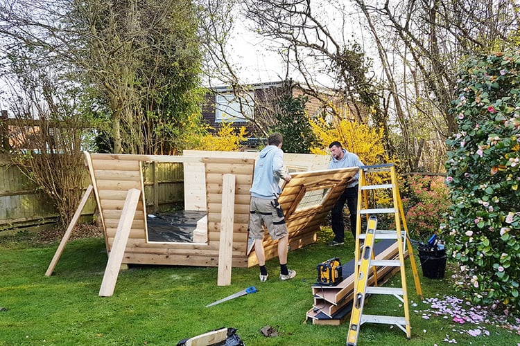 arctic cabins fitters constructing timber BBQ hut building