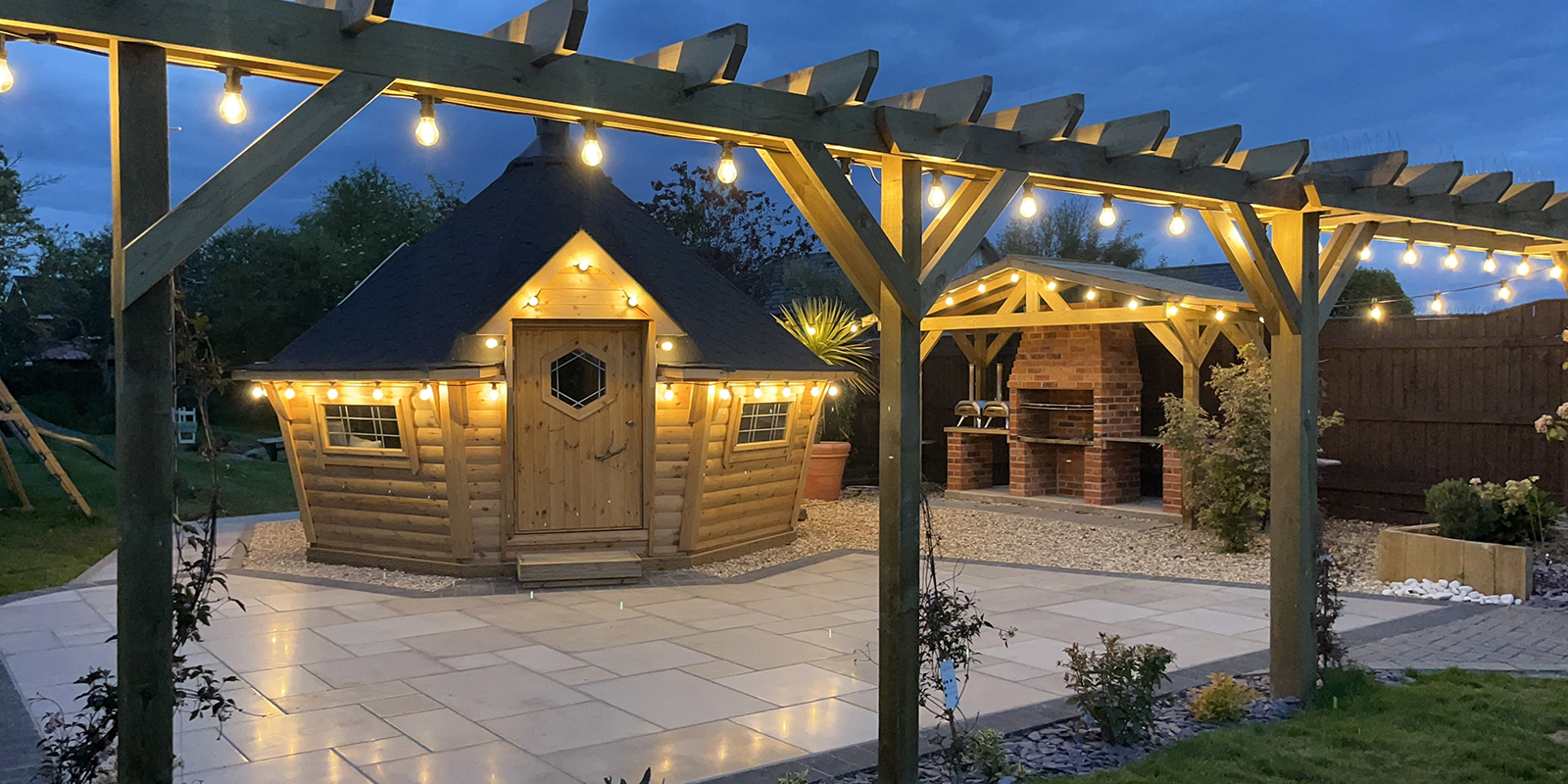 cabins lit up at night with fairy lights